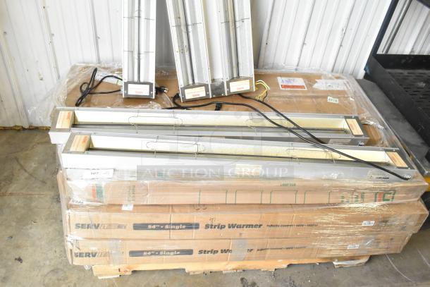 14 ServIt Strip Warmers, new scratch and dent, 120V, 1 Phase. Items stacked on labeled boxes.