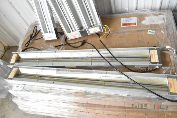 14 new ServIt strip warmers, 120V, scratch and dent condition. Labels with warnings visible. Auction for 14 units.