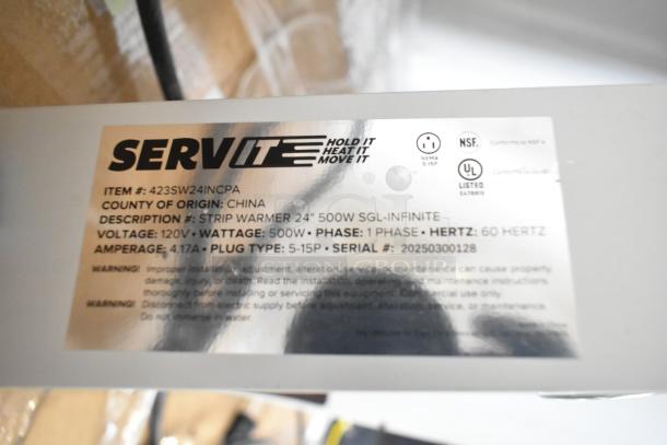 14 brand new ServIt strip warmers with 24" length, 500W, 120V, 1 phase. Includes serial number and safety labels.