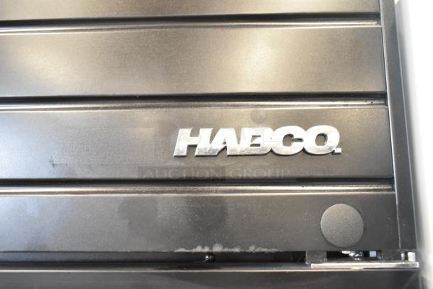 2019 Habco SE18 cooler detail showing brand logo on black exterior. Single door merchandiser, 115V, 1 Phase.