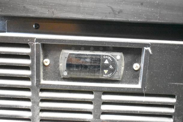 2019 Habco SE18 reach-in cooler, 115V, single door, commercial use. Temperature control panel shown, slightly worn.