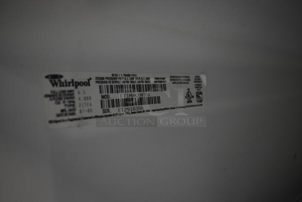 Whirlpool ET1MHKXMQ04 reach-in cooler with freezer, 115 volts, 1 phase, label shows model and serial number.