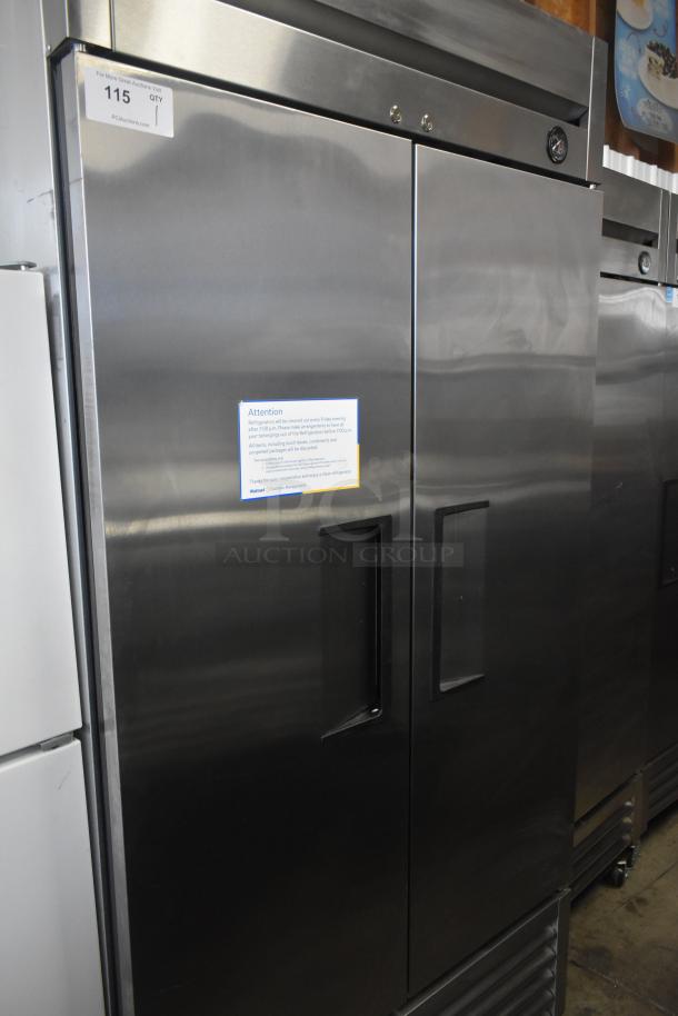 2016 True T-35 commercial 2-door reach-in cooler; stainless steel, 115V, 1 phase, excellent condition, auction tag visible.