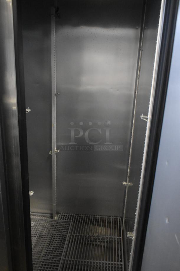 2016 True T-35 commercial 2 door reach-in cooler interior. Adjustable shelves, clean condition, 115 volts, 1 phase.