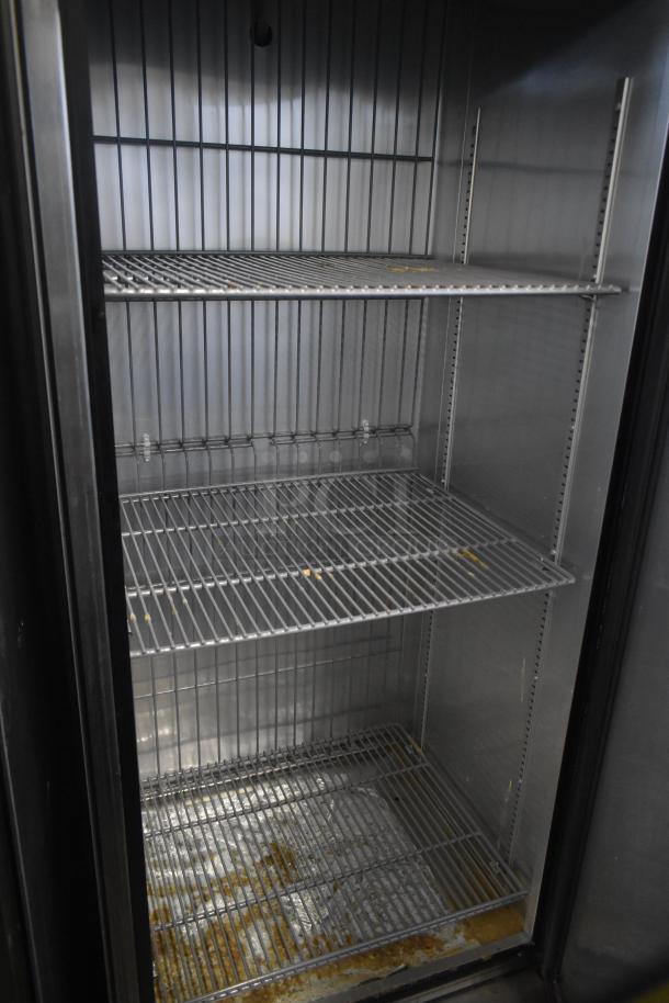 2016 True T-19F commercial single door reach-in freezer, 115V, 1 Phase, on casters. Interior shows wire shelving.