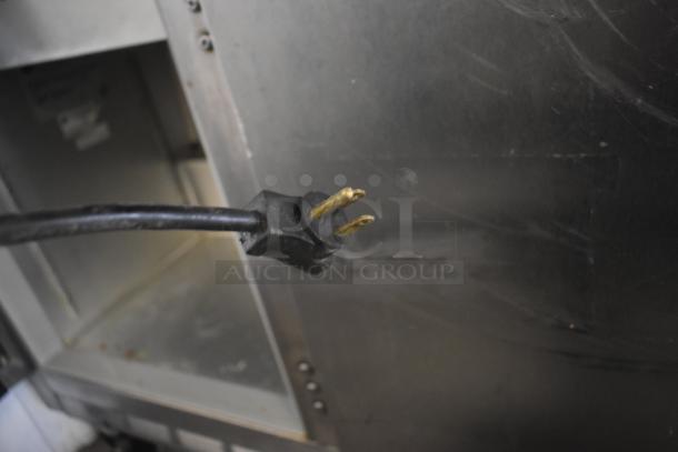 Beverage Air commercial prep table with mega top, 115V, 1 phase, on commercial casters. Visible power plug.