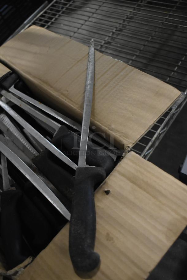 Box of 80 sharpened stainless steel knives, including fillet knife, with black handles. Auction item.