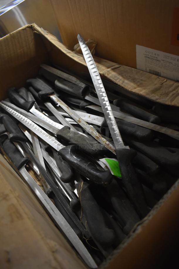 Box of 30 sharpened stainless steel knives, including fillet knife, with black handles and serrated edges.