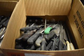 Box of 30 sharpened stainless steel knives including fillet and chef knives. Various handles, good condition.