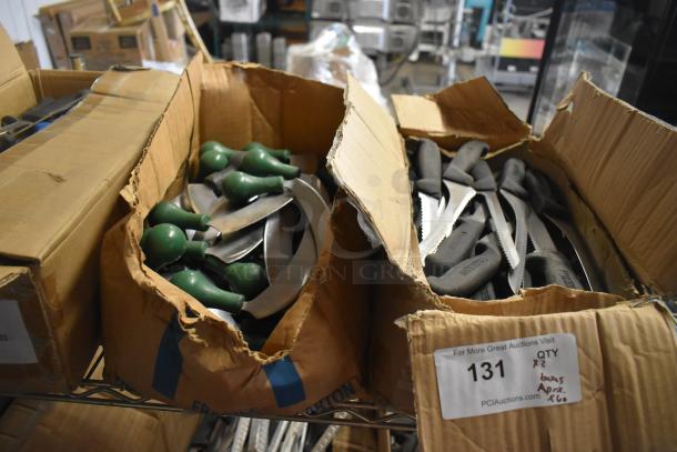 Boxes of 60 sharpened stainless steel knives, including serrated and rocking knives, in used condition. Auction label present.