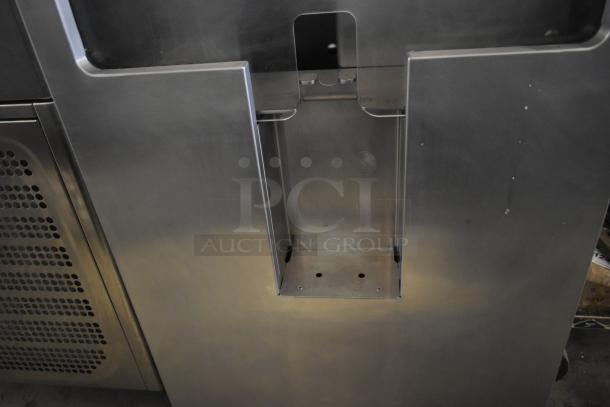 JBT 2ND-GEN-MFJ-HE citrus juicer, commercial floor model with stainless steel exterior and commercial casters.