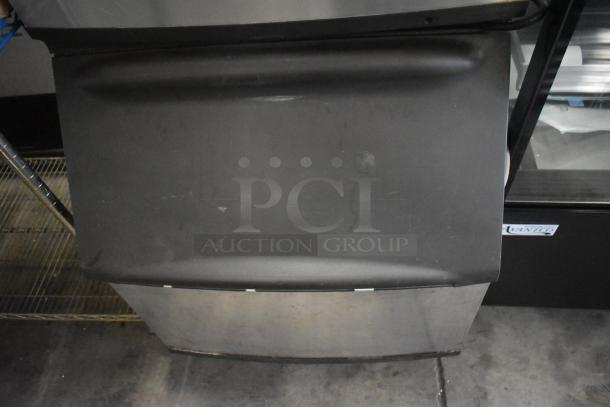 Manitowoc commercial ice head on ice bin, stainless steel, good condition, visible surface wear, suitable for restaurants.