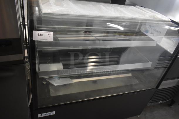 Brand new Avantco BC-48-HC 48" curved glass black refrigerated bakery display case with minor scratches, front view.