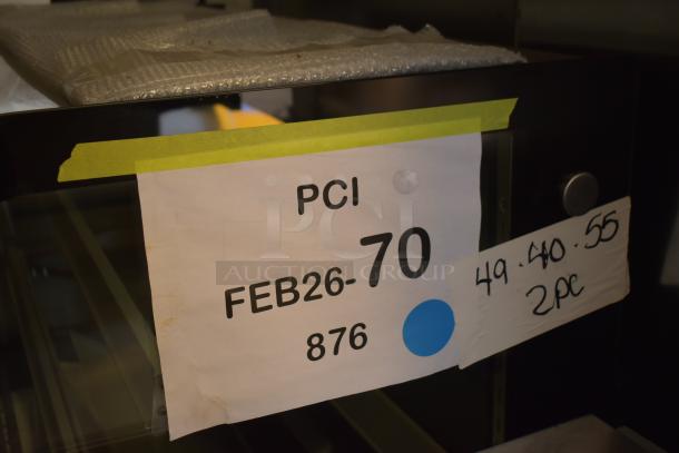 Brand new Avantco BC-48-HC 48" curved glass bakery display case in black. Scratch and dent condition with visible labels.