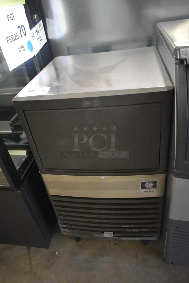 Manitowoc QM45A Ice Maker, undercounter, full cube, 95 lbs/day capacity, stainless-steel, 115V. Slight surface wear visible.