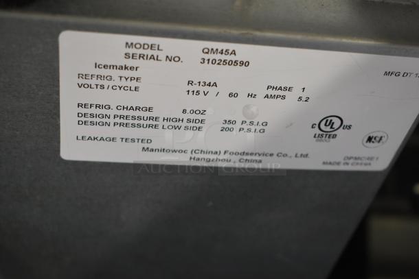 Manitowoc QM45A commercial ice maker label, model QM45A, 115V, 1 phase, R-134A refrigerant, 350 PSIG high pressure.
