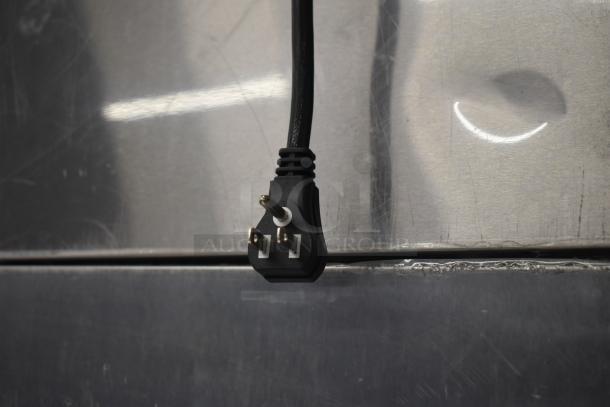 Turbo Air M3F24-1-N commercial freezer power plug and stainless steel surface detail.