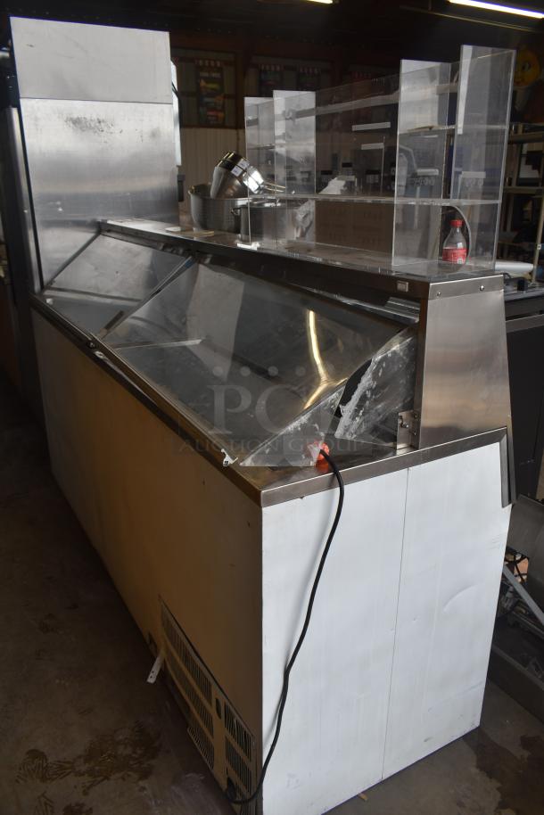 Master Bilt commercial ice cream dipping cabinet with stainless steel top, clear sliding lids, and attached power cord.