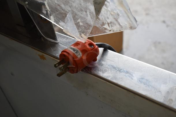 Master Bilt Commercial Ice Cream Dipping Cabinet with orange power plug; surface shows minor wear.