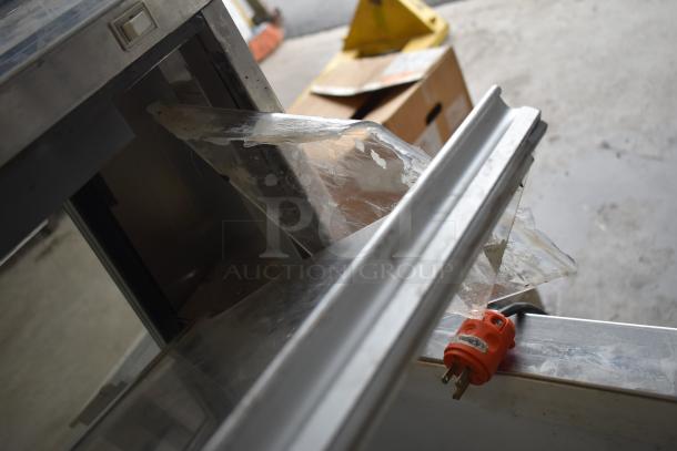 Master Bilt Commercial Ice Cream Dipping Cabinet, stainless steel, visible wear, power plug shown.