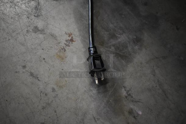 Avantco 177W50CKR electric plug on floor. Item is a new scratch and dent food warmer, 120V, 1-phase.