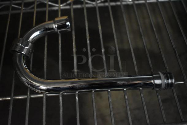 BRAND NEW SCRATCH AND DENT! Assure 190FW44G wall-mounted faucet with 3.5" swivel gooseneck spout, shown on metal rack.