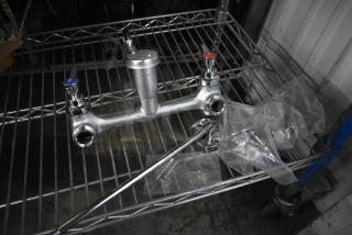 Brand new Regency 600FMS86 wall-mounted mop sink faucet with 6.5" spout, 8" centers, and vacuum breaker. Scratch and dent.