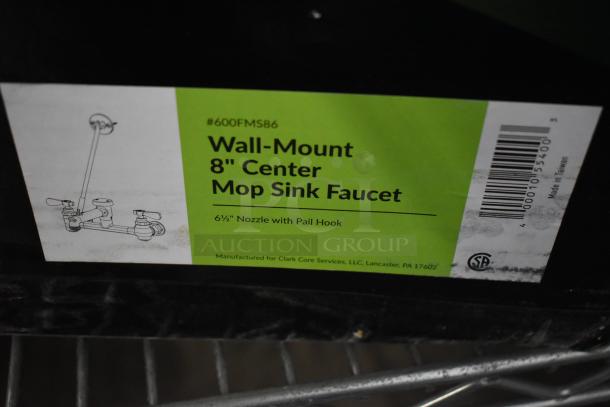 Brand new Regency 600FMS86 wall-mounted mop sink faucet with 6 1/2" spout, 8" centers, vacuum breaker; scratch and dent condition.