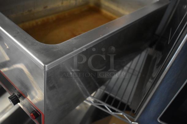 Winco FW-S500 Commercial Food Warmer. Stainless steel, used condition, 120 volts, 1 phase, controls visible on side.