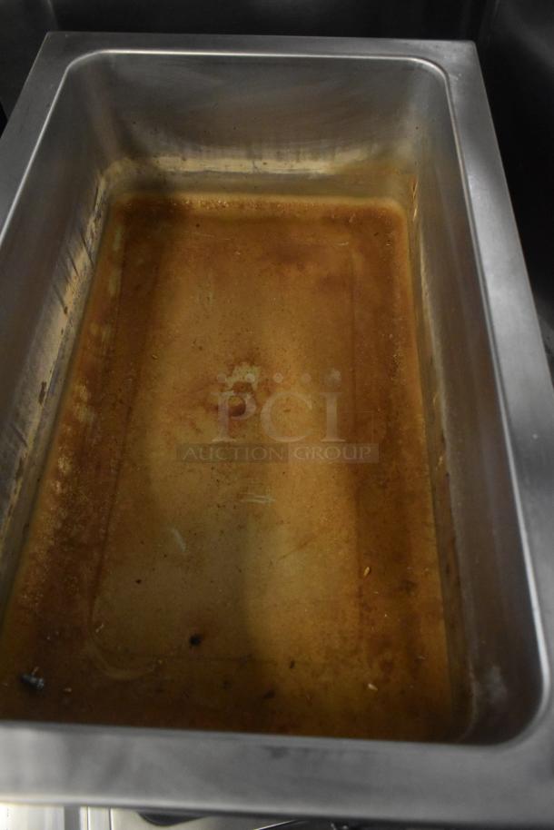 Winco FW-S500 Commercial Countertop Food Warmer, stainless steel, 120 volts, shows signs of use inside.