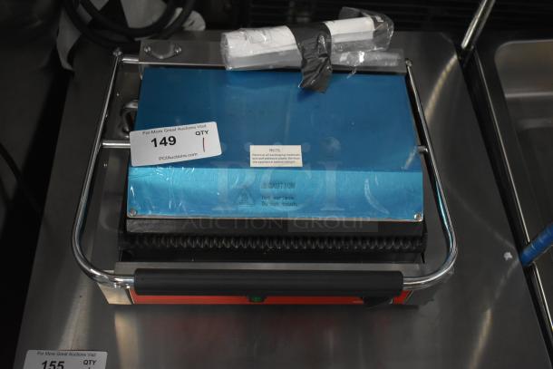 Avantco 177PG200 Commercial Panini Grill with grooved plates, 13 3/8" x 8 3/4" surface, new condition, 120V.