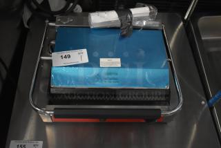 Avantco 177PG200 Commercial Panini Grill with grooved plates, 13 3/8" x 8 3/4" surface, new condition, 120V.