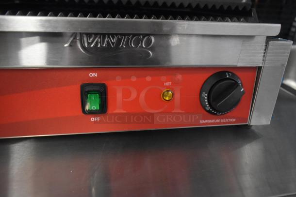 Avantco 177PG200 commercial panini grill with grooved plates, manual controls, and 13 3/8" x 8 3/4" cooking surface.