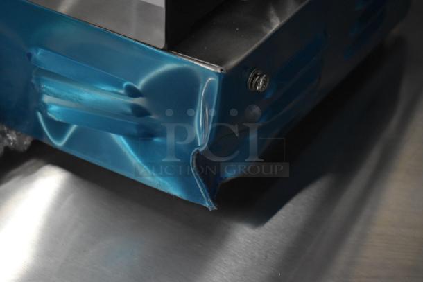 Avantco 177PG200 Panini Grill, scratch and dent, grooved plates, 13 3/8" x 8 3/4" surface, 120V, blue protective film.