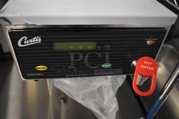 Brand new Curtis D60GT12A000 low profile thermal carafe coffee brewer, 120V, with scratch and dent, control panel view.