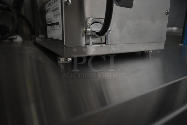 Brand new Curtis D60GT12A000 coffee brewer. Stainless steel base. 120V, 1 phase. Scratch and dent condition. Model label shown.