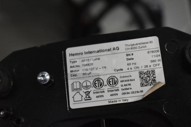 Label on Anfim AF05 Luna espresso grinder, showing model, serial number, voltage, and certifications. Made in Italy.