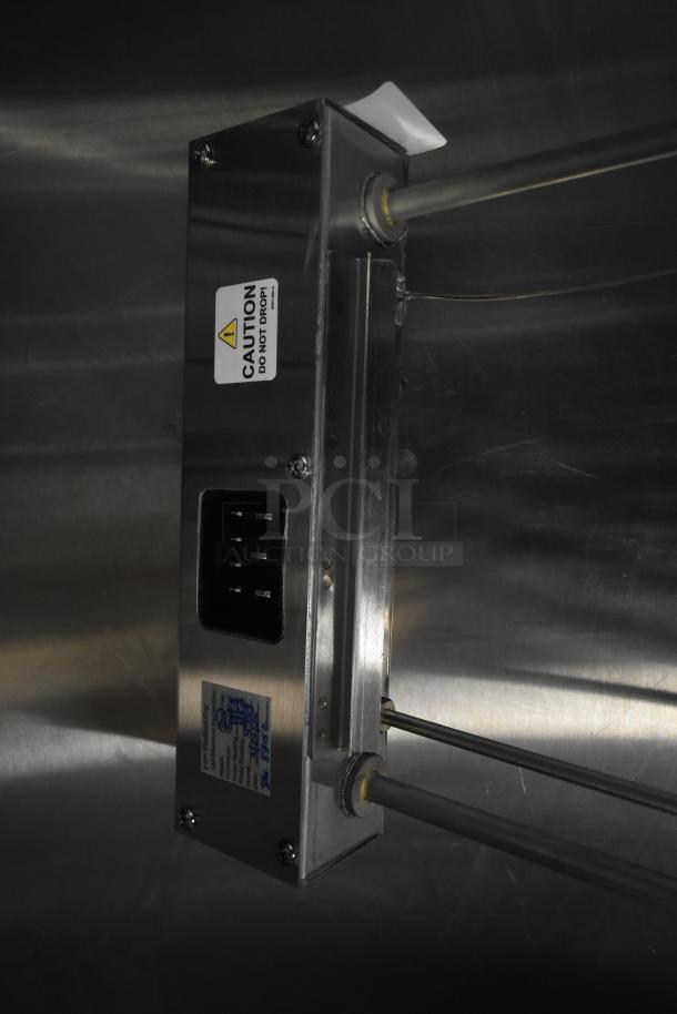 Brand new fryer burner with visible scratches and dents. Features metal rods, caution label, and manufacturer's markings.