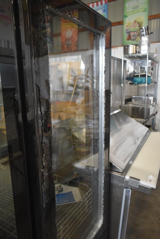 Brand new Avantco 193GD4C15HCB black 4-sided glass refrigerated display case with commercial casters. Some scratches visible.