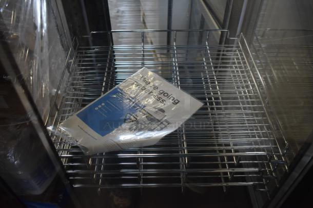 Brand new Avantco 193GD4C15HCB black refrigerated display case, 4-sided glass, with commercial casters. 110-120V, 1-phase.