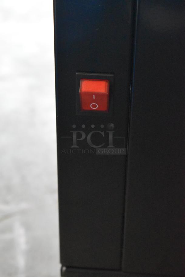 Red power switch on Avantco 193GD4C15HCB Black 4-Sided Glass Refrigerated Display Case, commercial casters, 110-120V.