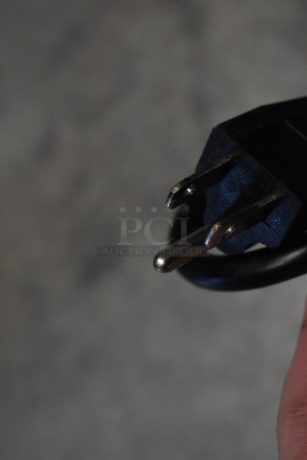 Close-up of a power plug for the Avantco 193GD4C15HCB glass refrigerated display case, brand new, 110-120V, 1 Phase.