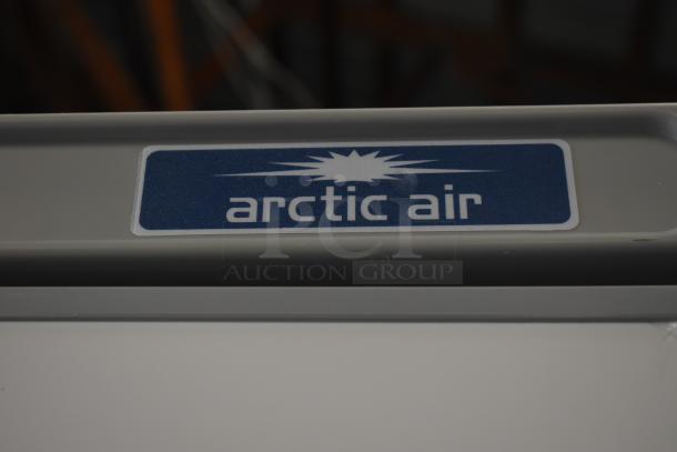 Alt text: Arctic Air logo on AWR25Z refrigerator, 25 cu. ft., single door, new with scratches and dents, 120V, 1 phase.