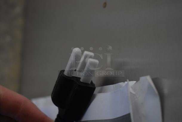 Close-up of ServIt 423HSW2036 heated shelf warmer plug. Brand new, scratch, and dent condition. Stainless steel. 120V, 1 phase.