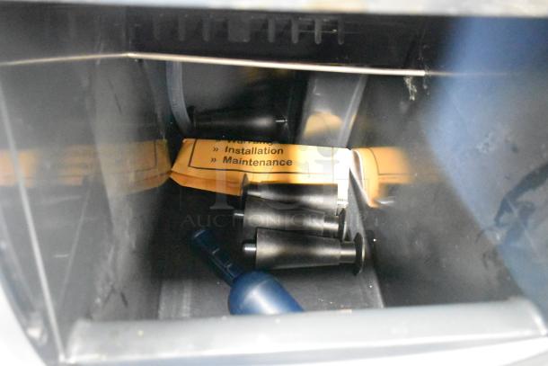 Brand new 2023 Scotsman CU0415MA-1A undercounter ice machine interior, includes components and installation instructions.