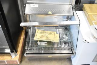 Brand new ServIt 423HDM26SA 26" 3-shelf heated display case with sliding doors, minor scratches and dents, 120V, 1 phase.