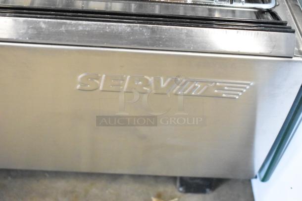 Brand new ServIt 423HDM26SA 26" heated display case. Stainless steel with sliding doors. Visible ServIt logo. 120V, 1 phase. Scratch and dent condition.