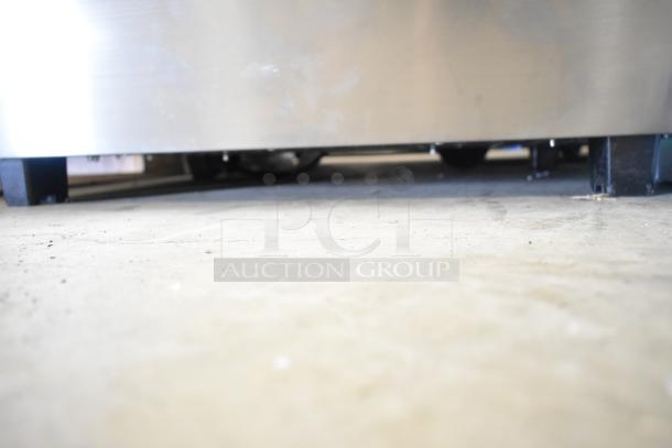 Brand new ServIt 423HDM26SA 26" heated display case, minor bottom dents visible. 120V, 1 Phase. Three shelves, sliding doors.