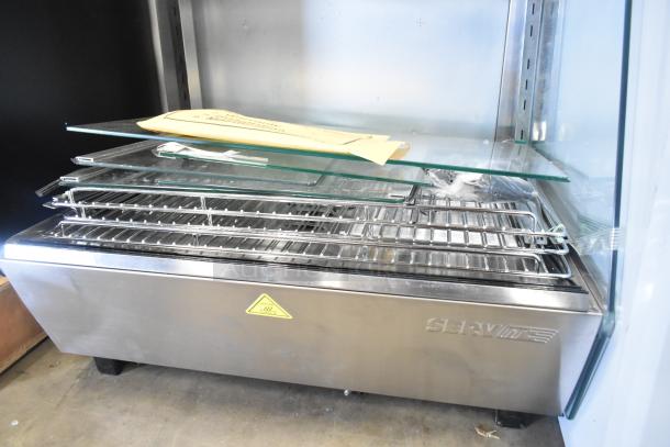 ServIt 423HDM26SA 26" heated display case, brand new with scratches, three shelves, sliding doors, runs on 120V.