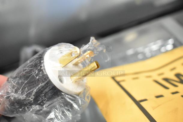 Close-up of a ServIt 423HDM26SA plug wrapped in plastic. Part of a countertop heated display case, 120V, 1 phase.